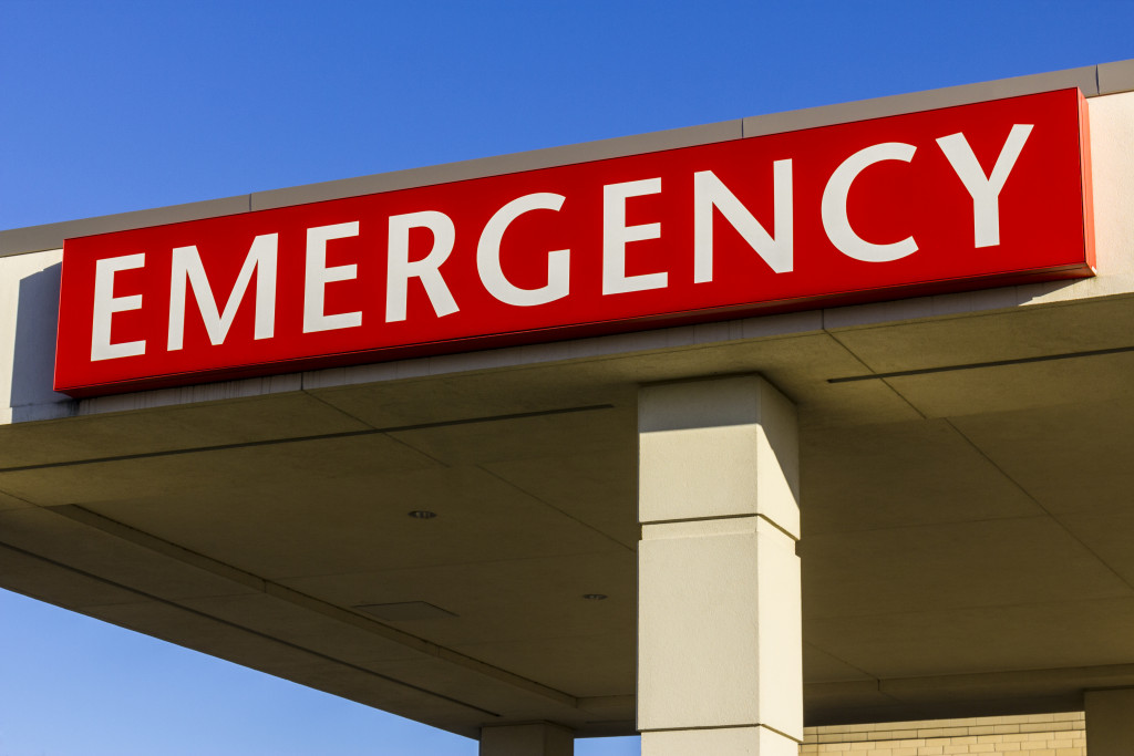 A red EMERGENCY sign at a hospital