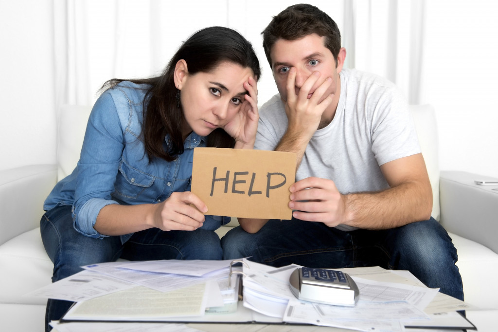 holding a help sign