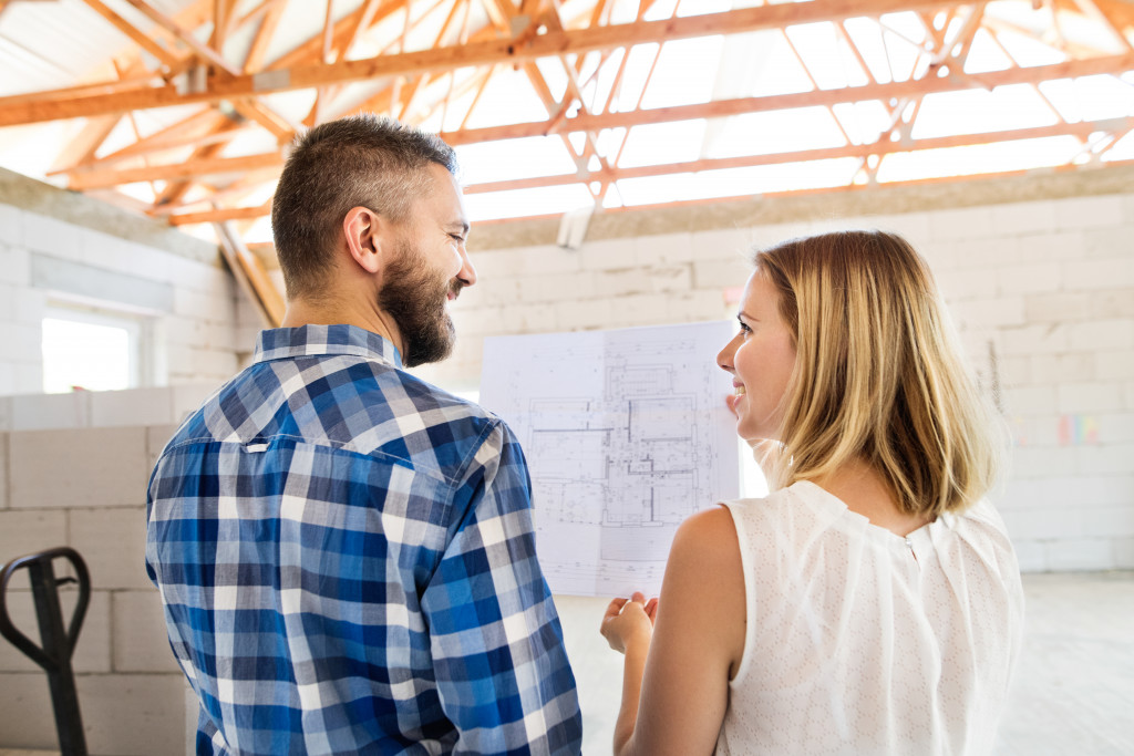 A couple exploring a construction site