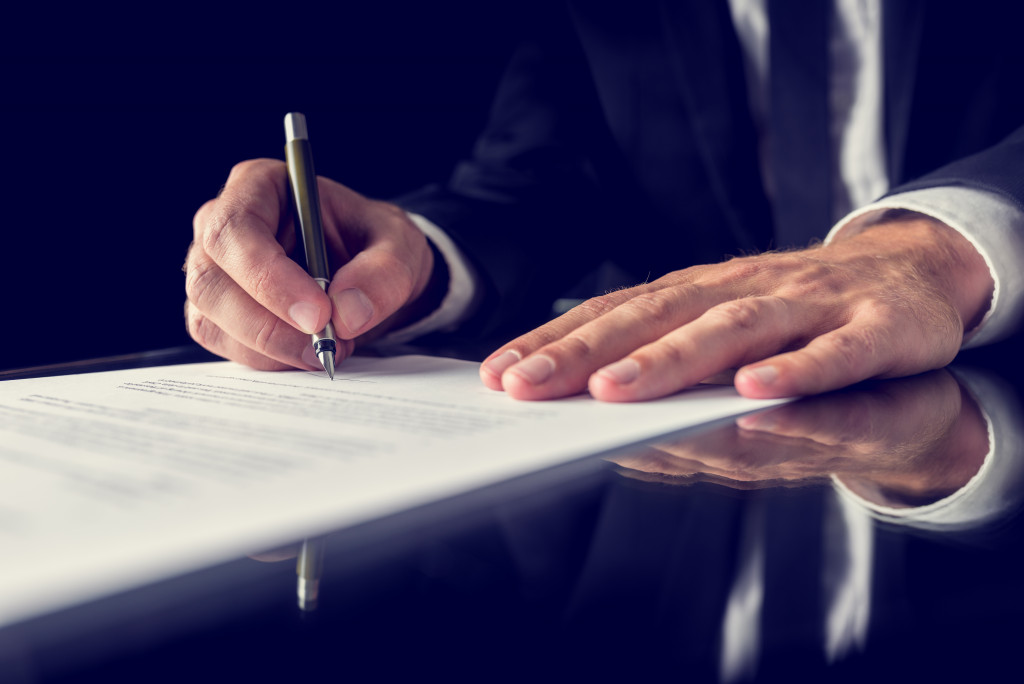 A businessman signing a contract