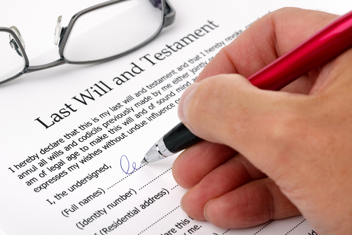 person signing a last will and testament document